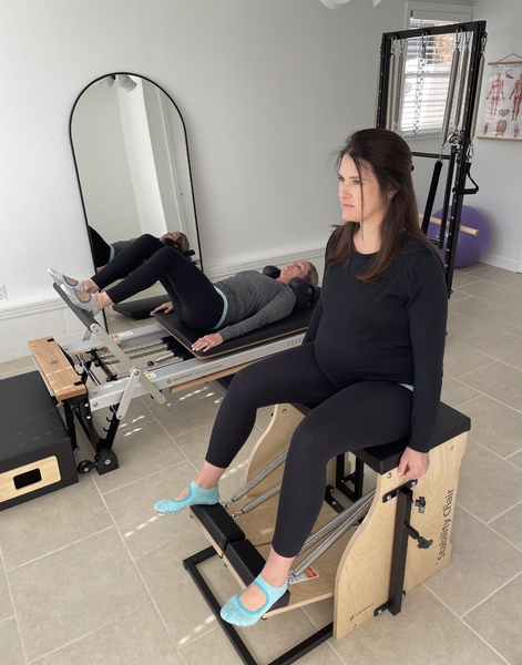 Duet pilates sessions in the home studio using the Reformer, Split Pedal Chair and tower