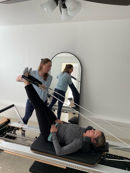 Private Reformer pilates using the reformer in home studio
