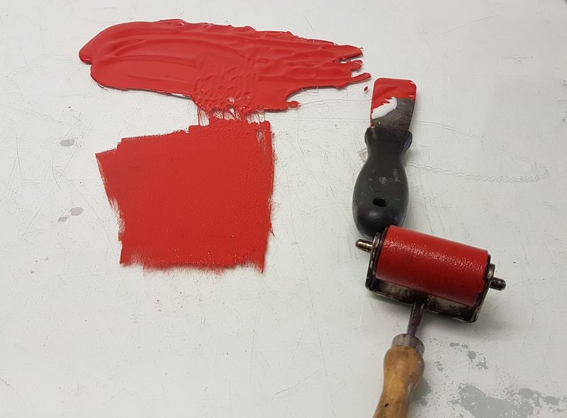 Rolling out ink in preparation for inking up a plate.